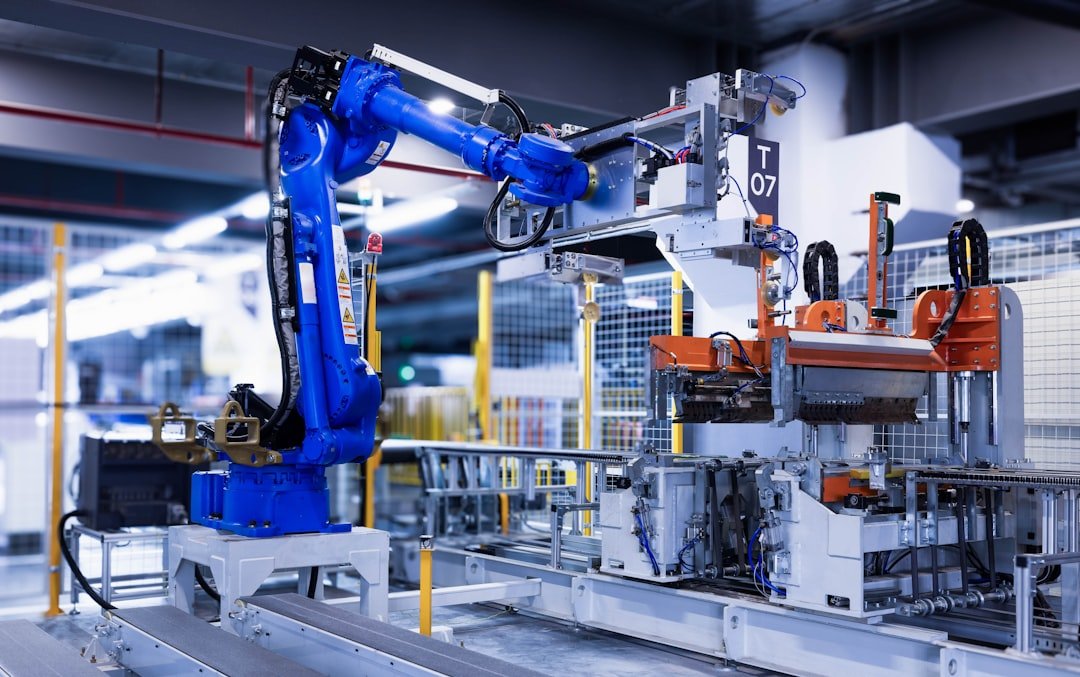 Industrial robot arm moving a molded component